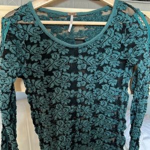 Green and black top. See through ! Size M